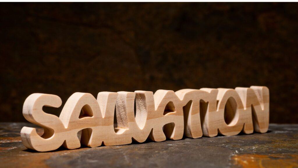 the word salvation spelled out with wooden letters